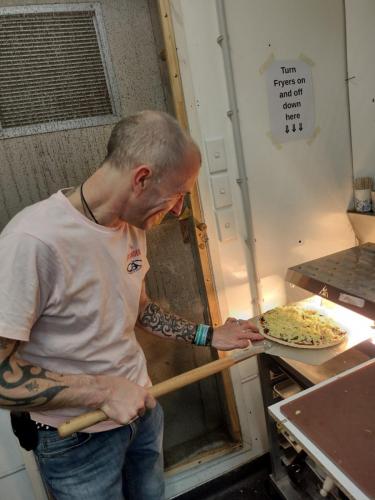 Jamie firing up the pizza oven